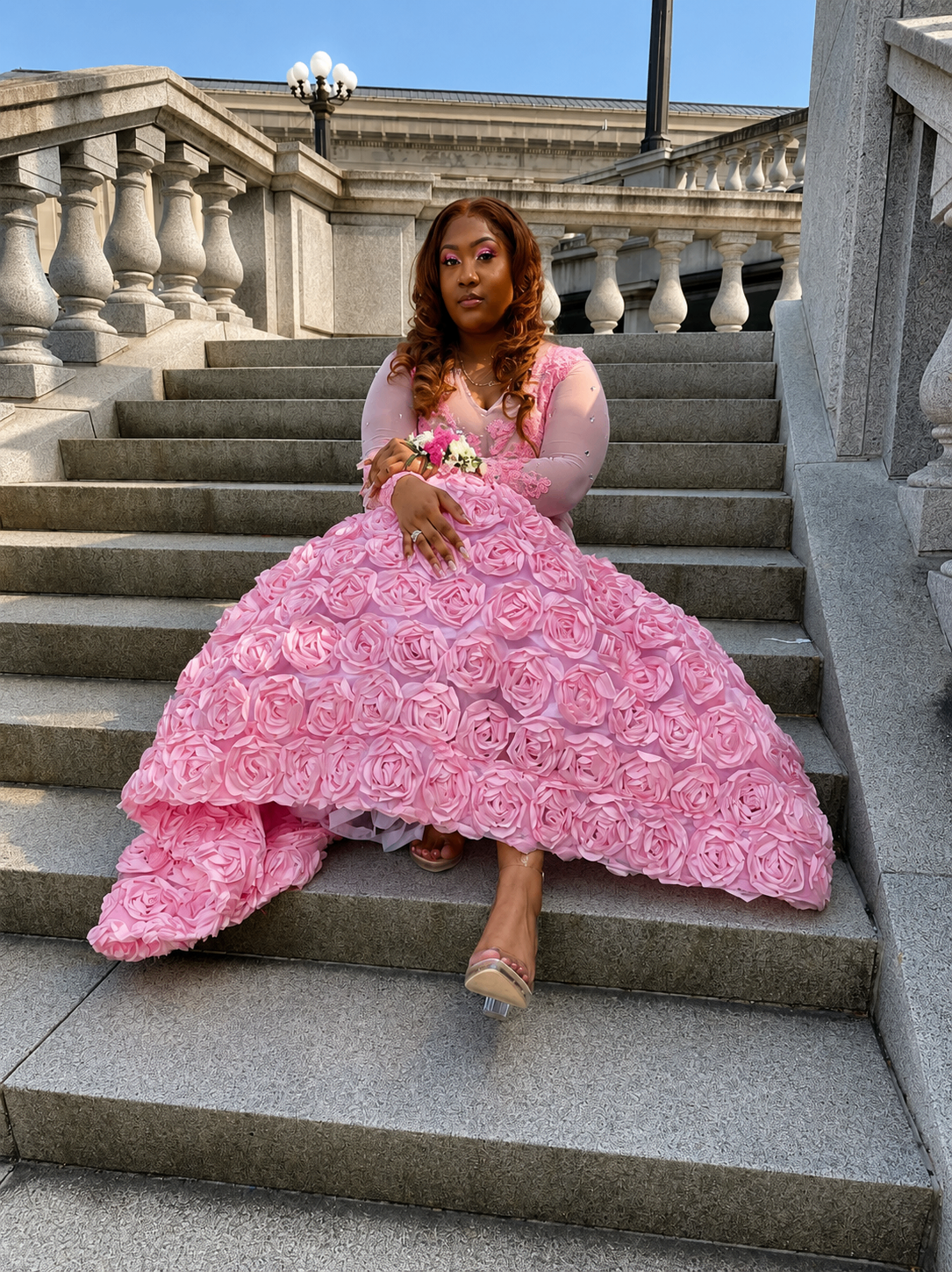 Custom pink rosette gown on a stairway
