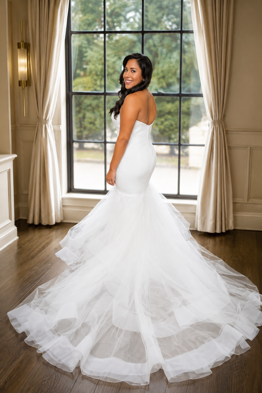 Strapless mermaid wedding gown with tiered tulle train